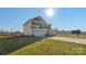 Two-story house with gray and beige siding, a large driveway, and a grassy yard at 821 Bethesda Rd, Statesville, NC 28677