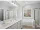 Bathroom boasts double vanity, soaking tub, and separate shower at 8720 Tamarron Dr, Charlotte, NC 28277