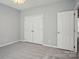 Bright bedroom with double doors and carpet at 8720 Tamarron Dr, Charlotte, NC 28277