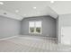 Spacious bonus room with sloped ceilings and carpet at 8720 Tamarron Dr, Charlotte, NC 28277