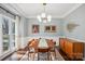 Mid-century modern dining room with hardwood floors and large windows at 8720 Tamarron Dr, Charlotte, NC 28277