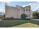 Rear view of house showing landscaping and AC units at 8720 Tamarron Dr, Charlotte, NC 28277