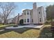 Two-story house with backyard patio and firepit at 8720 Tamarron Dr, Charlotte, NC 28277