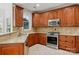 Kitchen with granite countertops and stainless steel appliances at 8720 Tamarron Dr, Charlotte, NC 28277