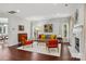 Living room featuring hardwood floors, fireplace, and mid century modern furniture at 8720 Tamarron Dr, Charlotte, NC 28277