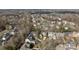 Aerial view of a neighborhood featuring tree-lined streets and manicured lawns at 8928 Heydon Hall Cir, Charlotte, NC 28210