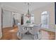 Bright dining room featuring a round table and hardwood floors at 8928 Heydon Hall Cir, Charlotte, NC 28210