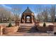 Brick gazebo offers a serene spot for relaxation with charming architectural details at 8928 Heydon Hall Cir, Charlotte, NC 28210