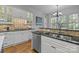 Well-equipped kitchen with white cabinets and granite countertops at 8928 Heydon Hall Cir, Charlotte, NC 28210