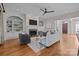 Light-filled living area with fireplace and hardwood floors at 8928 Heydon Hall Cir, Charlotte, NC 28210