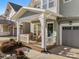 Inviting front porch with rocking chairs, adding character to this well-maintained home at 907 Millbrook Rd, Charlotte, NC 28211