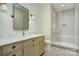 Light and bright bathroom with a walk-in shower and a wood vanity at 961 Jw Wilson Rd, Fort Mill, SC 29715