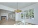 Sunlit dining room with hardwood floors, fireplace, and chandelier at 961 Jw Wilson Rd, Fort Mill, SC 29715