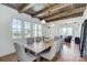 Charming dining room with wood beams, large windows, and a rustic table at 961 Jw Wilson Rd, Fort Mill, SC 29715