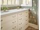 White hallway with floral wallpaper and built-in drawers at 961 Jw Wilson Rd, Fort Mill, SC 29715