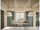 Kitchen with green cabinets, farmhouse sink, and two statement pendant lights at 961 Jw Wilson Rd, Fort Mill, SC 29715