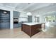 Kitchen with a large island, blue cabinets, and hardwood floors at 961 Jw Wilson Rd, Fort Mill, SC 29715