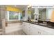 Elegant bathroom with double vanity and soaking tub at 1033 Merganser Way, Indian Trail, NC 28079