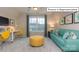 Versatile bonus room with sofa and workspace at 1033 Merganser Way, Indian Trail, NC 28079