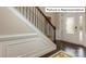 Elegant entryway with hardwood floors, wainscoting, and a staircase at 1033 Merganser Way, Indian Trail, NC 28079