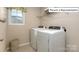 Functional laundry room with washer and dryer at 1033 Merganser Way, Indian Trail, NC 28079