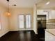 Bright dining area with French doors and a stainless steel refrigerator at 11155 Dundarrach Ln, Charlotte, NC 28277