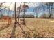 Large backyard with a bench and trees at 1301 Brandy Ln # 7, Shelby, NC 28152