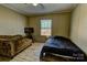 Cozy bedroom with a sofa and a window overlooking the backyard at 1301 Brandy Ln # 7, Shelby, NC 28152