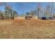 Tan mobile home with a large yard and covered porch at 1301 Brandy Ln # 7, Shelby, NC 28152
