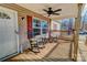 Two rocking chairs and a side table on a wooden porch at 1301 Brandy Ln # 7, Shelby, NC 28152