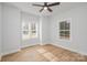 Bright bedroom with hardwood floors and two large windows at 136 Autumn Blaze Rd, China Grove, NC 28023