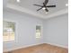 Spacious main bedroom with light walls, hardwood floors, and a ceiling fan at 136 Autumn Blaze Rd, China Grove, NC 28023