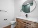 Modern bathroom with a vanity, toilet, and stylish green tile at 140 3Rd Se Ave, Hickory, NC 28602