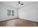 Well-lit bedroom with hardwood floors and two windows at 140 3Rd Se Ave, Hickory, NC 28602