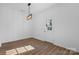 Bright dining area with hardwood floors and modern light fixture at 140 3Rd Se Ave, Hickory, NC 28602