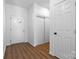 Bright entryway with hardwood floors, sliding doors, and exterior door at 140 3Rd Se Ave, Hickory, NC 28602