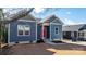 Blue craftsman style home with red door and a well-maintained lawn at 140 3Rd Se Ave, Hickory, NC 28602