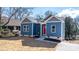 Charming craftsman style home with blue siding and red front door at 140 3Rd Se Ave, Hickory, NC 28602