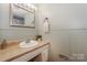 Bathroom featuring vanity with sink, framed mirror, and decorative towel rack at 170 Woodcrest Rd, Mooresville, NC 28115