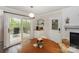 Cozy dining area with access to an outdoor deck with a tranquil wooded view at 170 Woodcrest Rd, Mooresville, NC 28115