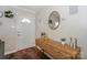 Inviting entryway featuring a console table, decorative mirror, and a well-lit foyer at 170 Woodcrest Rd, Mooresville, NC 28115