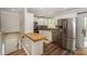 Modern kitchen featuring stainless steel appliances, white cabinetry, and granite countertops at 170 Woodcrest Rd, Mooresville, NC 28115