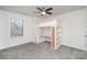 Bedroom with built-in loft bed and workspace at 17613 Shasta Daisy Cir, Davidson, NC 28036