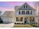 Two-story house with gray and white siding, two-car garage, and landscaping at 17613 Shasta Daisy Cir, Davidson, NC 28036