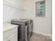 Laundry room with washer, dryer, and overhead shelving at 17613 Shasta Daisy Cir, Davidson, NC 28036