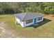 Small white house with a dark gray roof and teal door at 2091 & 2095 Catawba River Rd, Fort Lawn, SC 29714