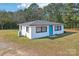 Single-story white house, dark gray roof, teal door at 2091 & 2095 Catawba River Rd, Fort Lawn, SC 29714