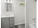 Clean bathroom with grey vanity, white bathtub, and a window at 2091 & 2095 Catawba River Rd, Fort Lawn, SC 29714