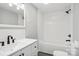 Updated bathroom with white subway tile shower, white vanity, and black fixtures at 2091 & 2095 Catawba River Rd, Fort Lawn, SC 29714