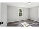 Bright bedroom with large window and wood-look flooring at 2091 & 2095 Catawba River Rd, Fort Lawn, SC 29714
